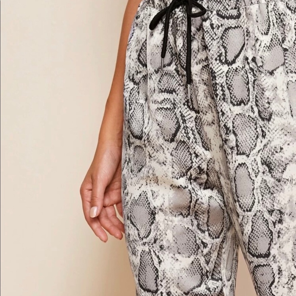 Snakeskin print trousers with drawstring waist